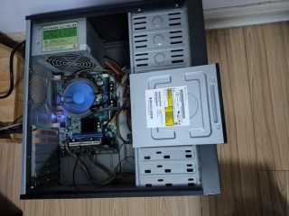 联想微型计算机怎么放光盘？联想微型计算机怎么使用