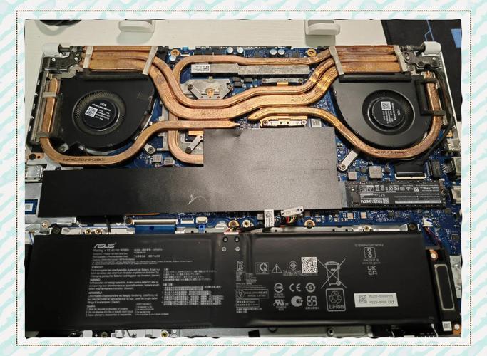 华硕天选mini鼠标怎么打开盖子装电池?