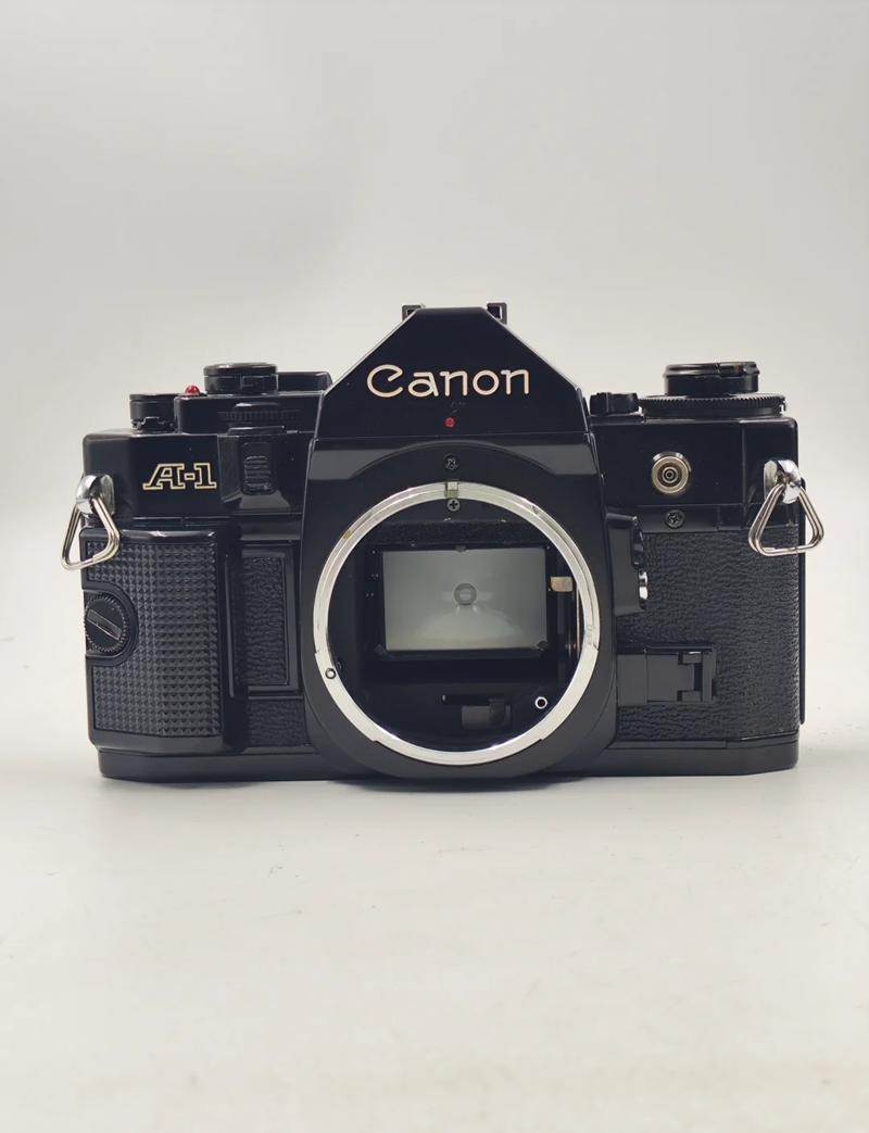 佳能A1胶卷机打开镜头盖但是还是看不到是为什么?